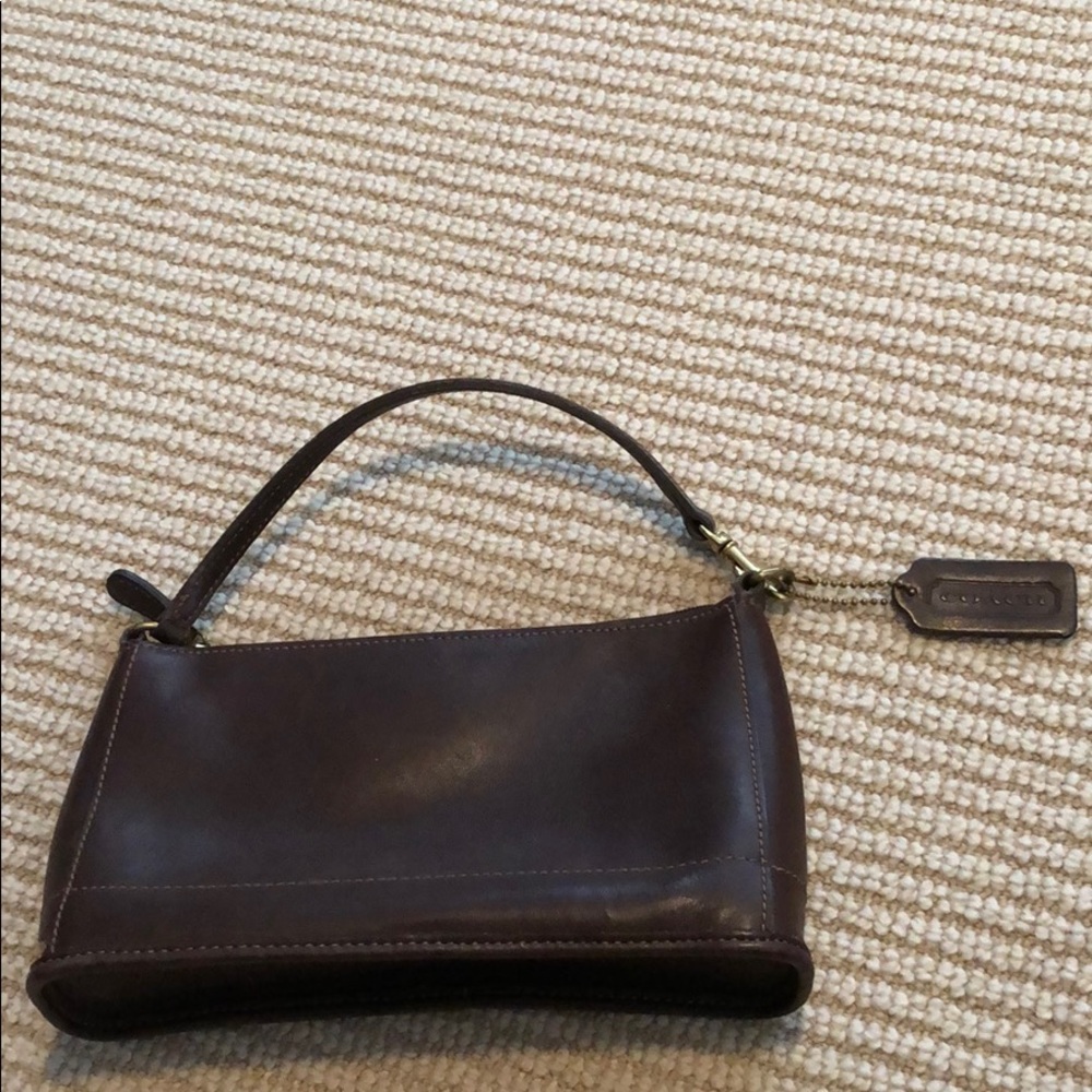 Adorable coach brown leather with accent stitching